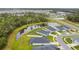 Aerial view of community, showing ponds, green spaces, and residences at 7164 Twisting Pines Loop, Zephyrhills, FL 33541