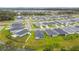 Aerial view of community, showing homes and green spaces at 7164 Twisting Pines Loop, Zephyrhills, FL 33541