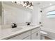 Modern bathroom featuring double sinks, white cabinets, and shower-tub combination at 7164 Twisting Pines Loop, Zephyrhills, FL 33541