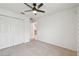 Comfortable bedroom with carpeting and closet at 7164 Twisting Pines Loop, Zephyrhills, FL 33541