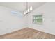 Dining room with wood floors, recessed lighting, and a window with a view at 7164 Twisting Pines Loop, Zephyrhills, FL 33541