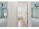 Hallway view to bathroom featuring a tub/shower combo at 7164 Twisting Pines Loop, Zephyrhills, FL 33541