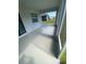 Enclosed patio with screens has ample space for outdoor lounging or dining at 7164 Twisting Pines Loop, Zephyrhills, FL 33541