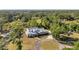 Beautifully set among a forest, this property includes a circle driveway, dormer windows, and meticulous landscaping at 806 Linwood Ter, Lutz, FL 33549