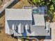 Aerial view showcases the home's roof, pool, and surrounding landscape at 806 Linwood Ter, Lutz, FL 33549