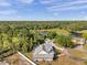 Enjoy serene privacy in this home with lake and forest views, a circle driveway and meticulously kept landscaping at 806 Linwood Ter, Lutz, FL 33549