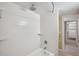 Clean, bright bathroom with tile shower and view of the custom closet at 806 Linwood Ter, Lutz, FL 33549
