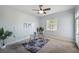 Bedroom with ceiling fan, neutral walls, carpet floors, and glass door at 806 Linwood Ter, Lutz, FL 33549