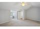 Bright bedroom features neutral tones, a ceiling fan, and a built-in desk at 806 Linwood Ter, Lutz, FL 33549