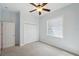 Bedroom features a window, carpet flooring, light-colored walls and a closet at 806 Linwood Ter, Lutz, FL 33549
