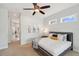 Bright bedroom boasts a comfortable bed, contemporary decor, and access to the en-suite bathroom at 806 Linwood Ter, Lutz, FL 33549