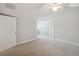 Spacious, carpeted bedroom featuring neutral paint, ceiling fan, and ample natural light at 806 Linwood Ter, Lutz, FL 33549