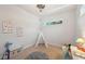 Light-filled bedroom with a play teepee, educational posters, and neutral carpeting at 806 Linwood Ter, Lutz, FL 33549