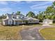 Exterior showcasing the house and detached garage with ample driveway space at 806 Linwood Ter, Lutz, FL 33549