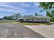 Charming home with a landscaped front yard and long driveway at 806 Linwood Ter, Lutz, FL 33549