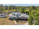 Stunning home boasts three dormers and meticulously landscaped front yard with sidewalk leading to the front door at 806 Linwood Ter, Lutz, FL 33549