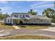 Charming single-story home boasts a manicured front yard with mature landscaping at 806 Linwood Ter, Lutz, FL 33549