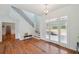 Bright foyer with hardwood floors, staircase, and glass front door at 806 Linwood Ter, Lutz, FL 33549