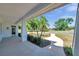 Spacious front porch overlooking a landscaped yard with a curved walkway, providing a welcoming entrance at 806 Linwood Ter, Lutz, FL 33549