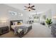 Serene main bedroom featuring soft carpet, ample natural light, and stylish furnishings at 806 Linwood Ter, Lutz, FL 33549