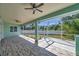 Large screened-in patio area with tiled flooring for outdoor enjoyment at 806 Linwood Ter, Lutz, FL 33549
