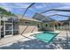 Inviting screened-in pool area with a pristine pool and a spacious deck at 806 Linwood Ter, Lutz, FL 33549