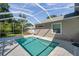 Backyard with a screened-in pool and a well-maintained lawn at 806 Linwood Ter, Lutz, FL 33549