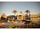 Club center, showcasing a water fountain, manicured landscaping, and diverse architectural styles at 8116 Painted Sky Pl, Land O Lakes, FL 34637