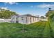 Spacious backyard with well-maintained lawn, privacy fence, and mature trees at 8845 123Rd Way, Seminole, FL 33772