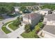 Property featuring a well-maintained lawn, mature landscaping, and an attached two-car garage at 9107 Gablewood Pl, Land O Lakes, FL 34638