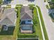 Aerial view of the home with screened-in pool and lush landscaping at 9107 Gablewood Pl, Land O Lakes, FL 34638
