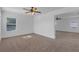 Spacious bedroom with carpet, ceiling fan, and natural light at 9107 Gablewood Pl, Land O Lakes, FL 34638