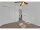 Bright bedroom with neutral carpet, ceiling fan, and closet at 9107 Gablewood Pl, Land O Lakes, FL 34638