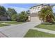Charming two-story home featuring a neutral color palette, arched windows, and a two-car garage at 9107 Gablewood Pl, Land O Lakes, FL 34638