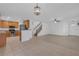 Open floor plan connecting the living room and kitchen, perfect for entertaining and Gathering time at 9107 Gablewood Pl, Land O Lakes, FL 34638