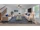 Open-concept living room featuring neutral walls and flooring, offering a versatile space at 9107 Gablewood Pl, Land O Lakes, FL 34638