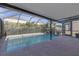 Screened-in pool with brick patio and sunny exposure at 9107 Gablewood Pl, Land O Lakes, FL 34638