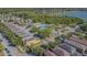 View shows a sprawling community with homes, green spaces, and amenities near the lake at 9205 English Oaks Ln, Riverview, FL 33578