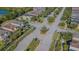 An aerial view shows the well maintained neighborhood, landscape and roads of this community at 9205 English Oaks Ln, Riverview, FL 33578