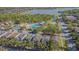 The community also includes a sparkling blue pool, clubhouse, and green spaces near a lake at 9205 English Oaks Ln, Riverview, FL 33578