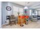 Open floor plan featuring a bar area with seating and natural light at 9205 English Oaks Ln, Riverview, FL 33578