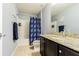 Bathroom with granite countertop on the vanity and a shower/tub combo at 9205 English Oaks Ln, Riverview, FL 33578