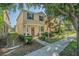 Charming two-story home featuring a welcoming front porch and a beautifully landscaped yard at 9205 English Oaks Ln, Riverview, FL 33578