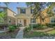Charming two-story home featuring a welcoming front porch and well-maintained landscaping at 9205 English Oaks Ln, Riverview, FL 33578