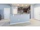 Open kitchen featuring stainless steel appliances, granite counters, and breakfast bar at 9205 English Oaks Ln, Riverview, FL 33578