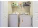 Laundry room with side-by-side washer and dryer, plus wire shelving at 9205 English Oaks Ln, Riverview, FL 33578