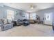Spacious living room with lots of natural light, comfortable seating, and a cozy atmosphere at 9205 English Oaks Ln, Riverview, FL 33578