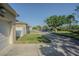 A street view of a home and neighborhood showcasing the lawn, street, and community at 9205 English Oaks Ln, Riverview, FL 33578