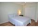 Bedroom featuring a light blue bedspread, a closet, and wood floors at 940 Virginia St # 304, Dunedin, FL 34698