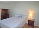 Bedroom featuring a light blue bedspread, and wood floors at 940 Virginia St # 304, Dunedin, FL 34698